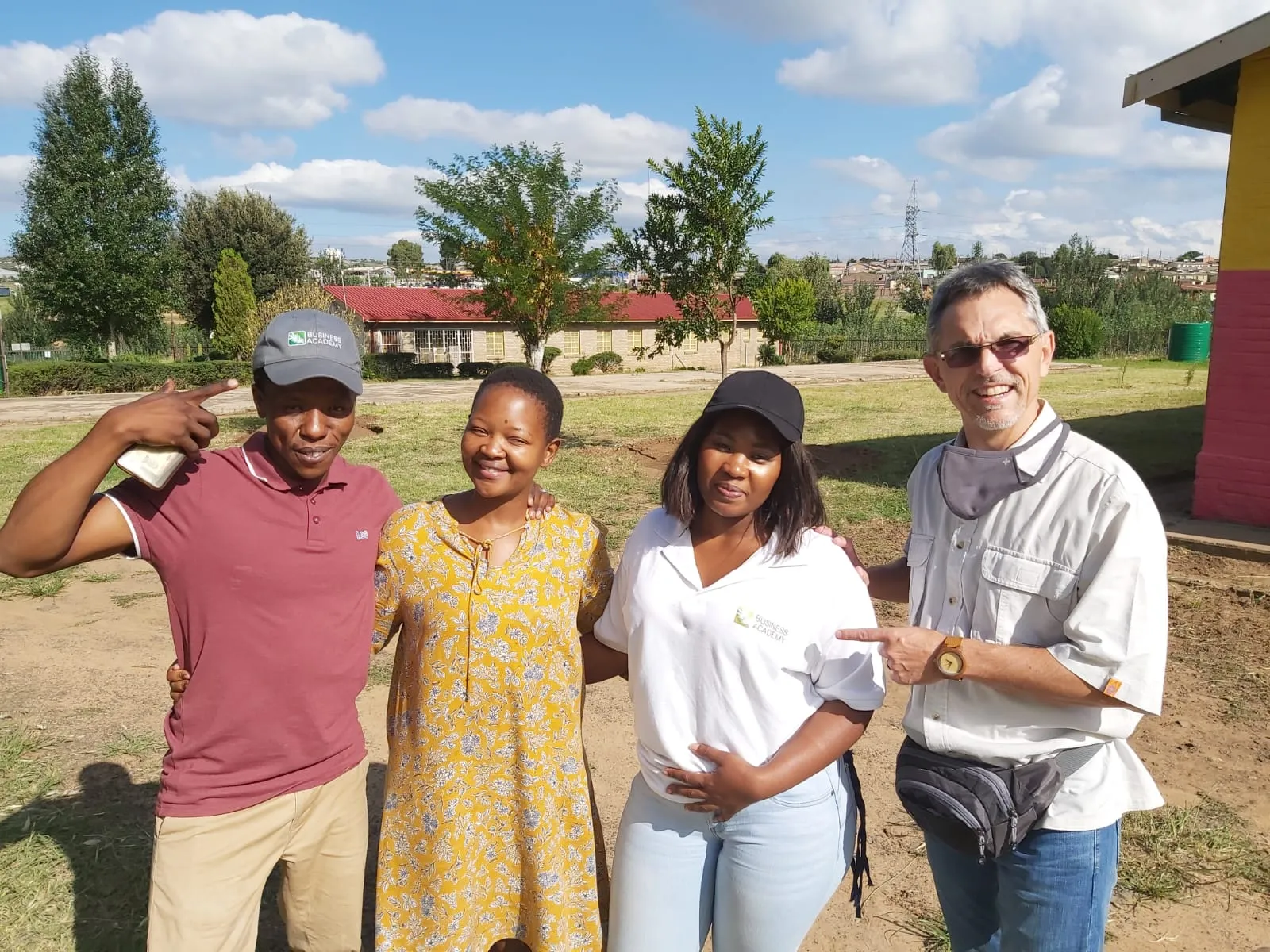 Business Academy team members with community members outdoors